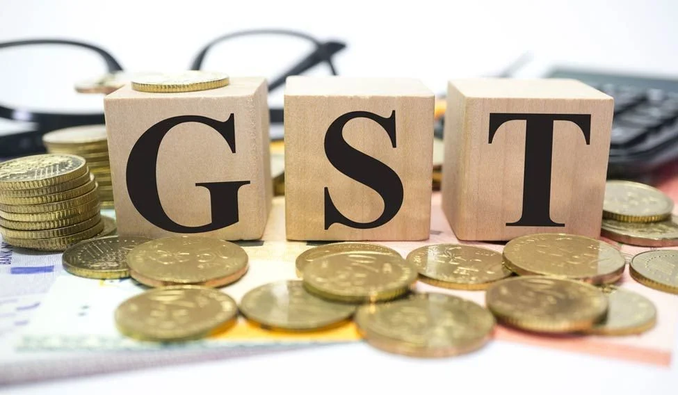 Các khối chữ GST và tiền xu